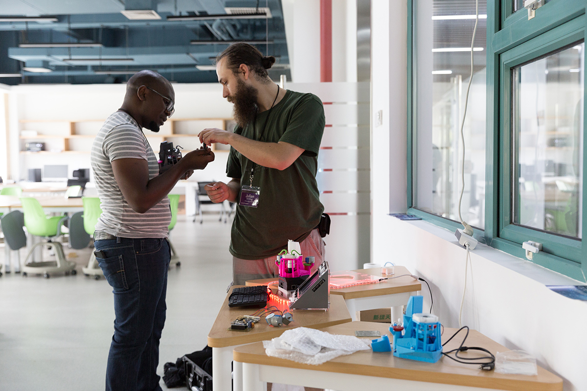 Members of Bongo Tech and Research Labs, assemble OpenFlexure Microscopes for display at GOSH Global 2018. Photo courtesy OpenFlexure Project.